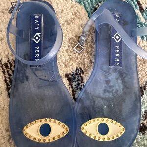 Katy Perry Blue Jelly Sandals with Gold Eye Accent